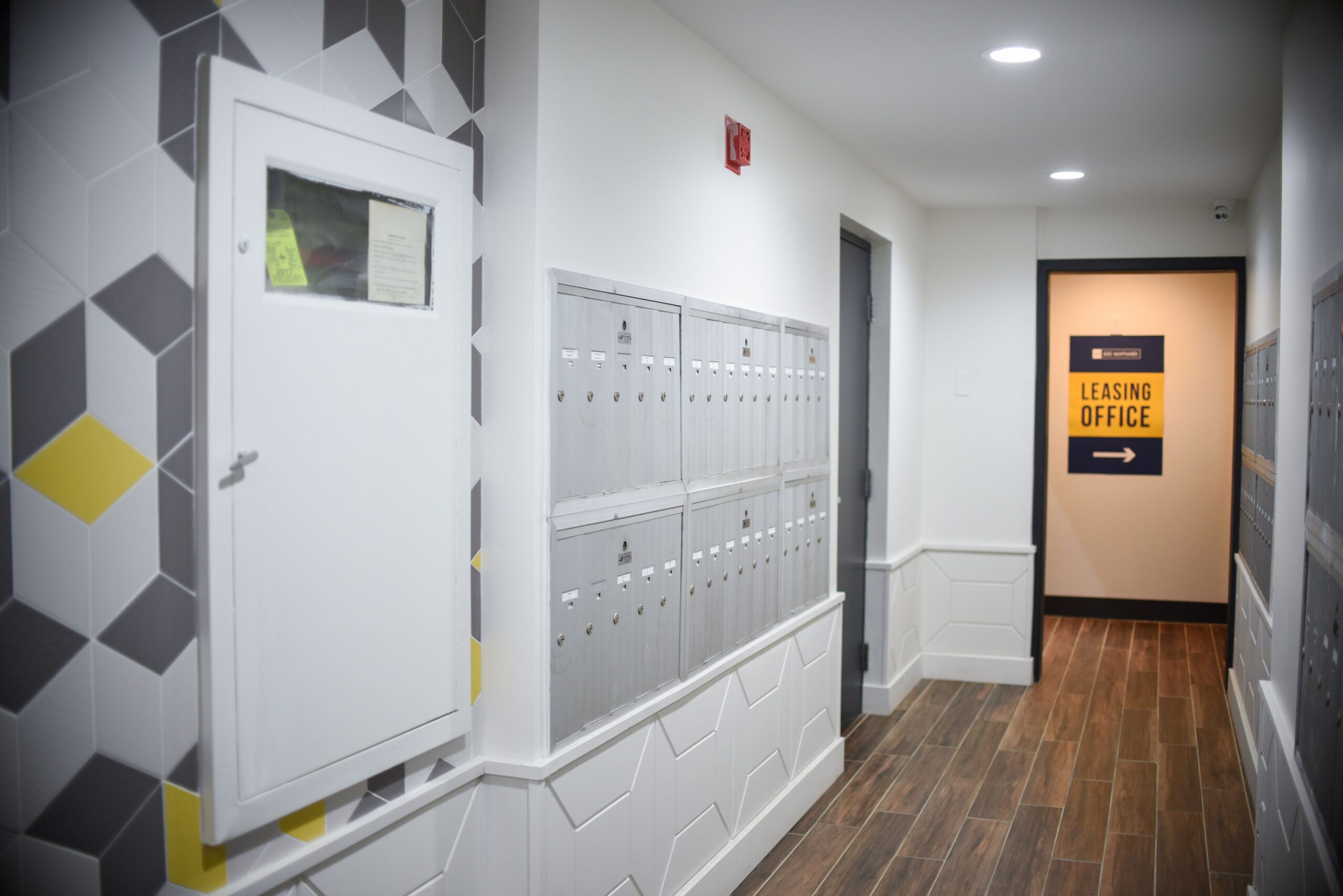 Indoor apartment corridor with mailboxes scaled