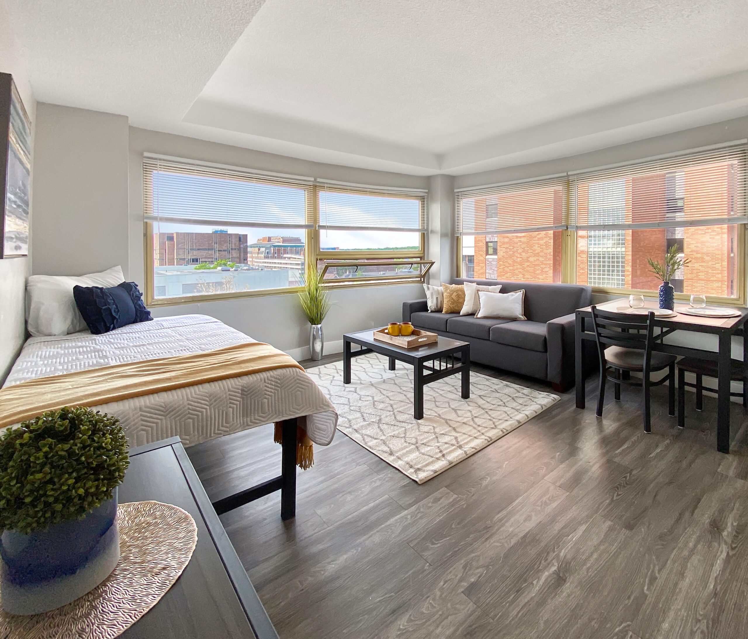 bright studio apartment interior bed living dining scaled