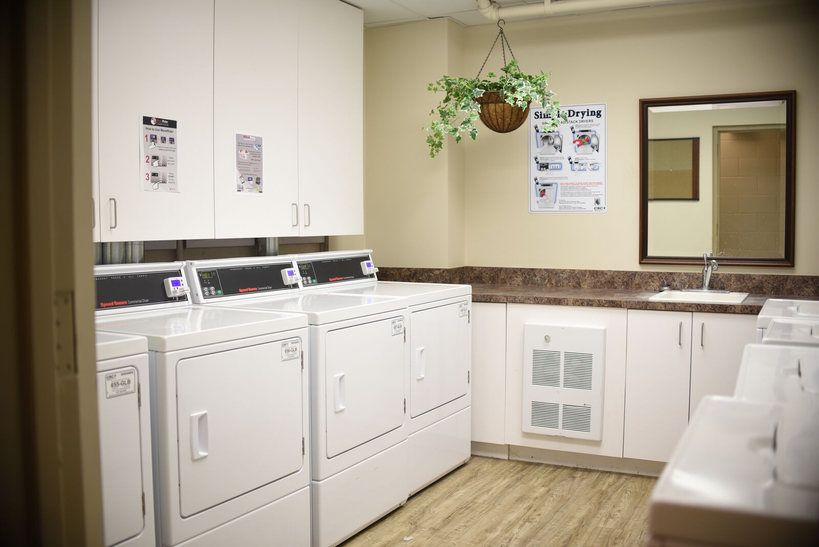 clean resident laundry room speed queen washers dryers