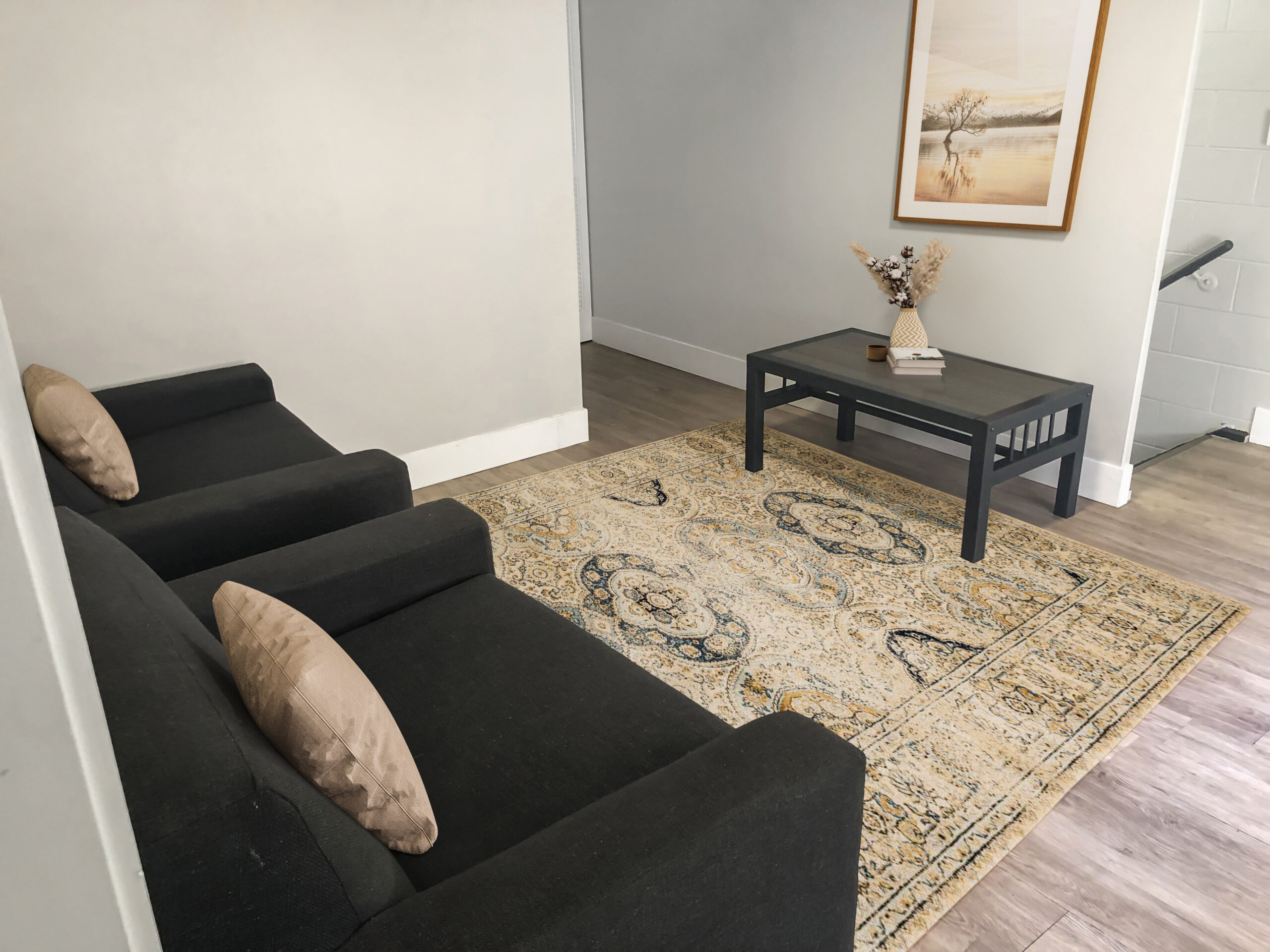 cozy townhome living room lounge dark armchairs