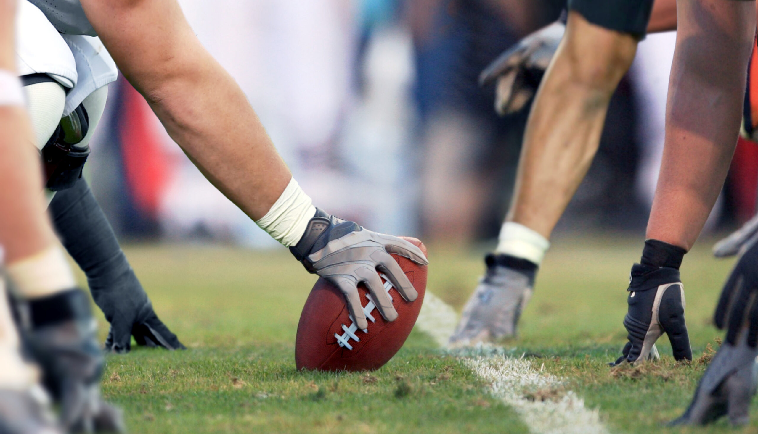 football player at line of scrimmage scaled