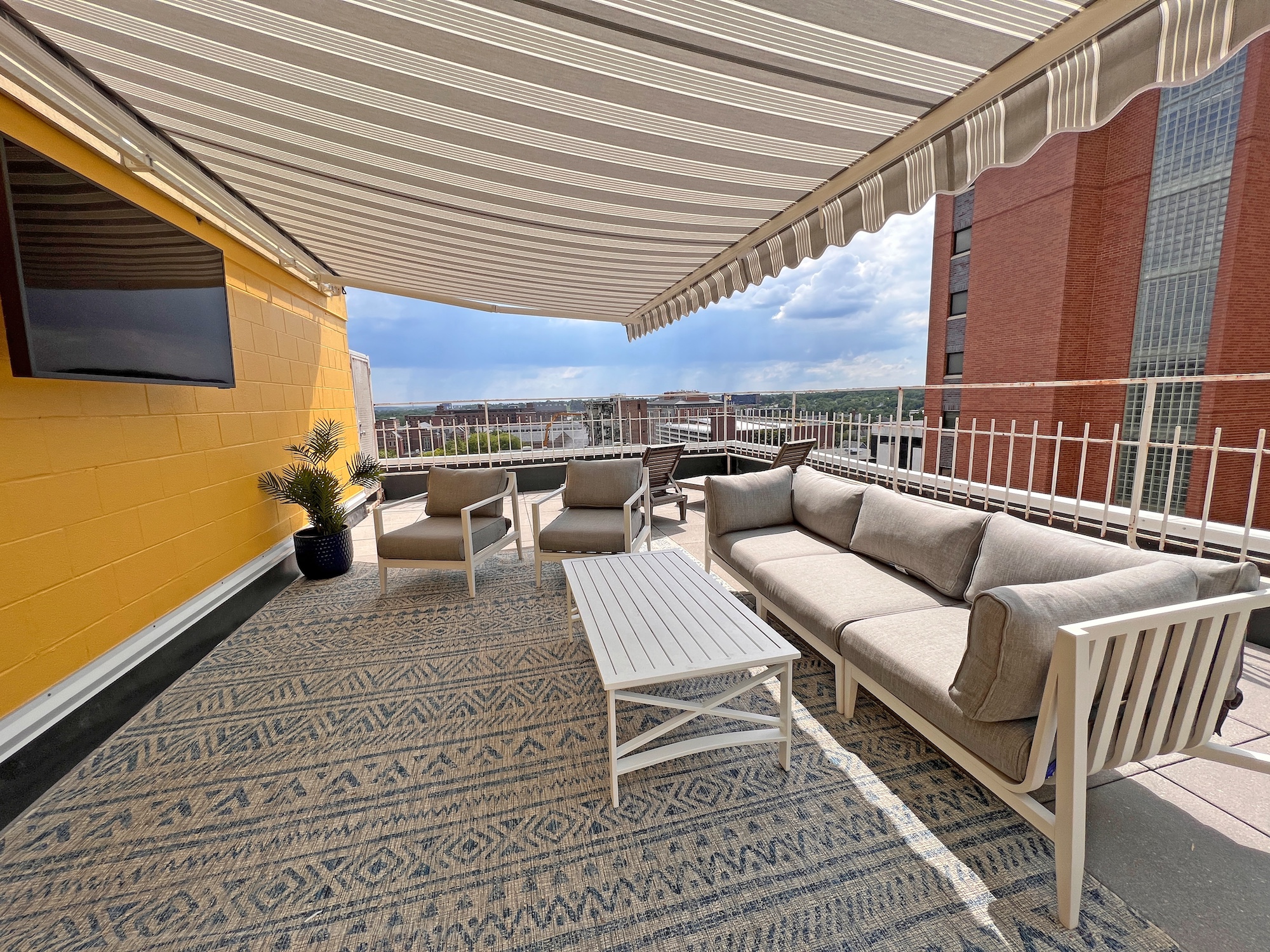 outdoor rooftop deck patio seating tv canopy