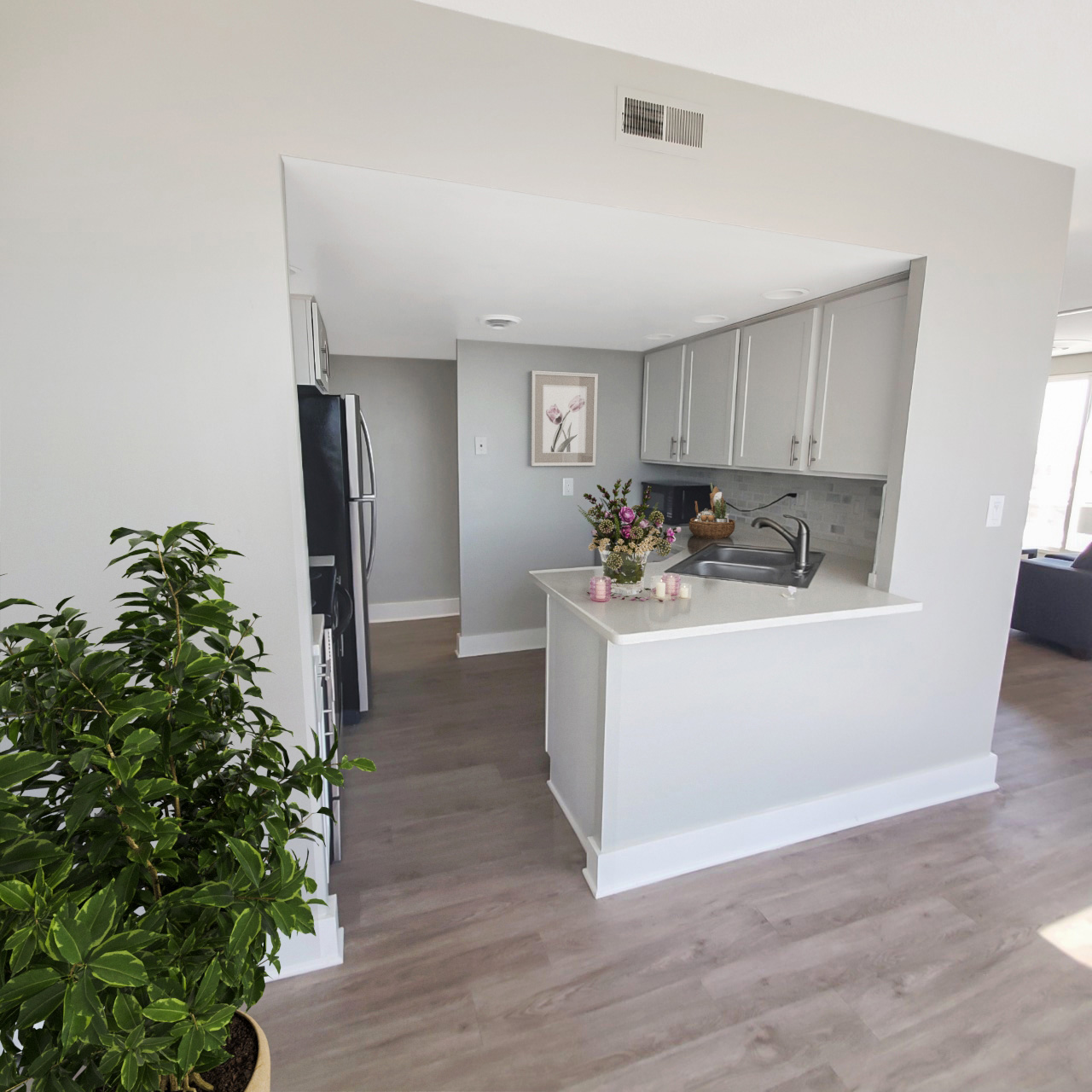 penthouse apartment kitchen cutout light gray cabinets
