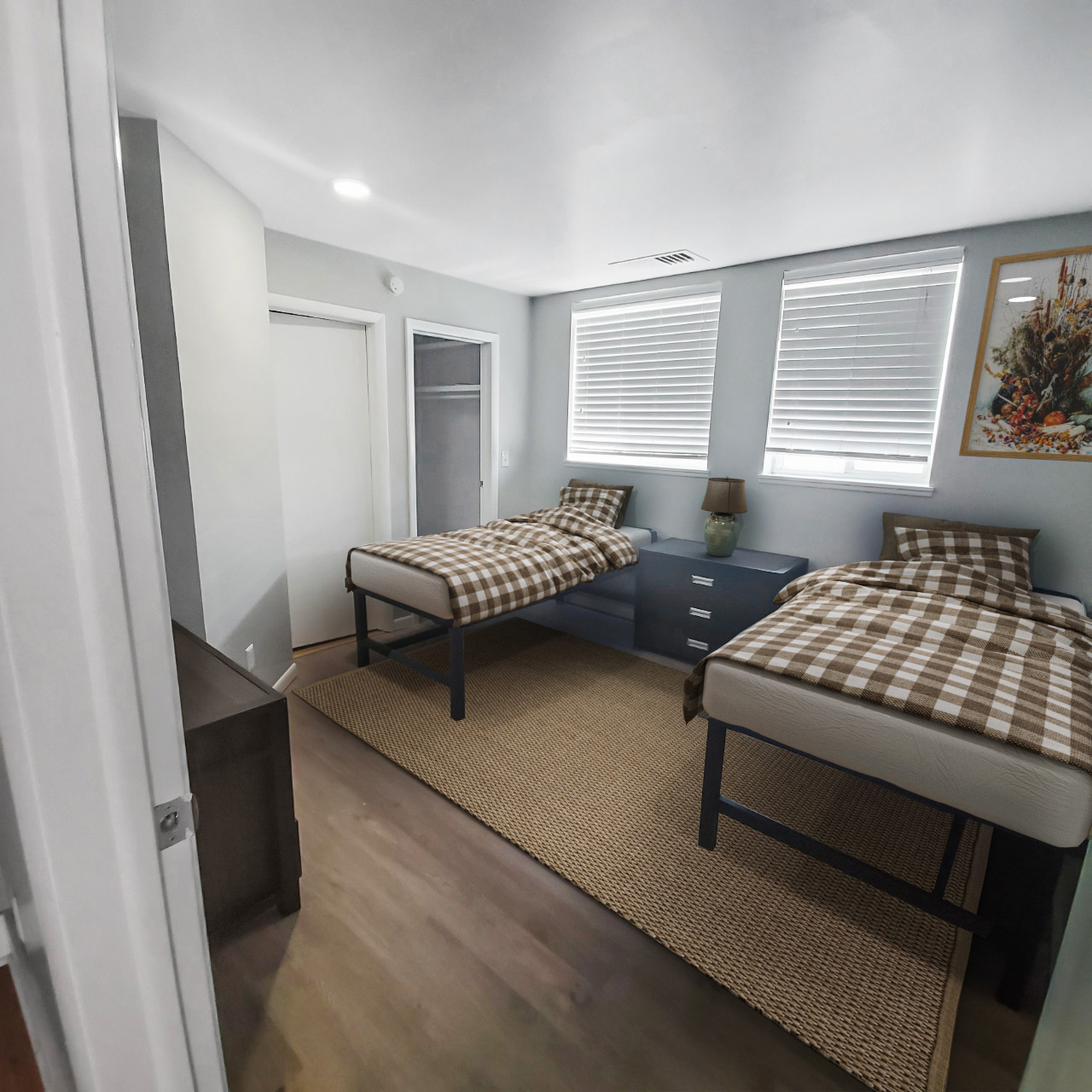 penthouse bedroom two twin beds plaid bedding